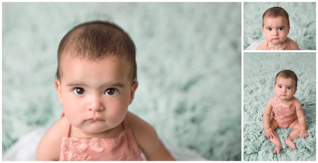 Six month session with baby girl in pink romper on mint flokati