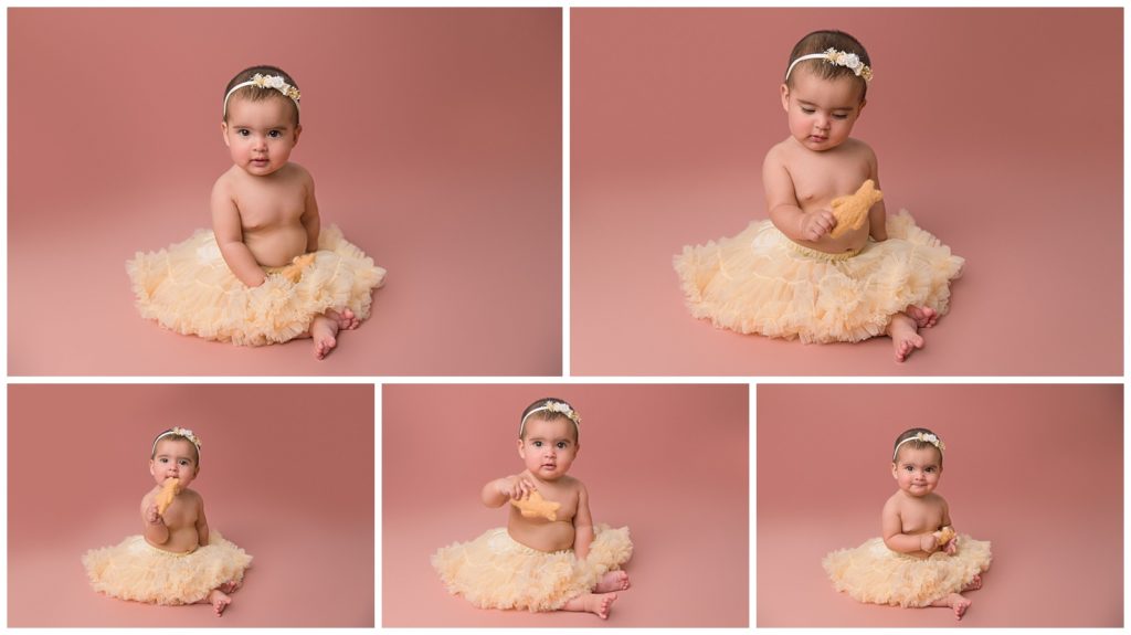 Baby girl in a tutu on pink background with bow in her hair
