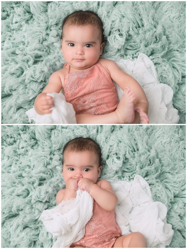 Six month session with baby girl in pink romper on mint flokati