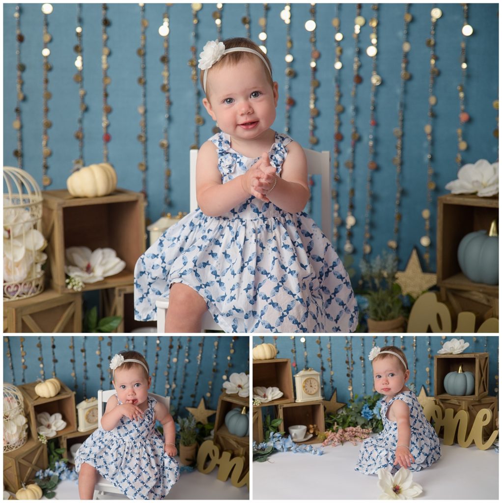 baby girl in white chair in cinderella first birthday