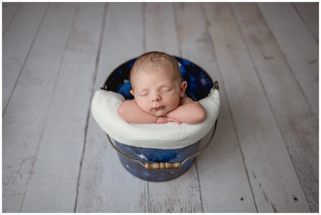 newborn baby boy in a bucket