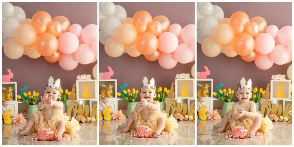 baby girl covered in cake from her photo session