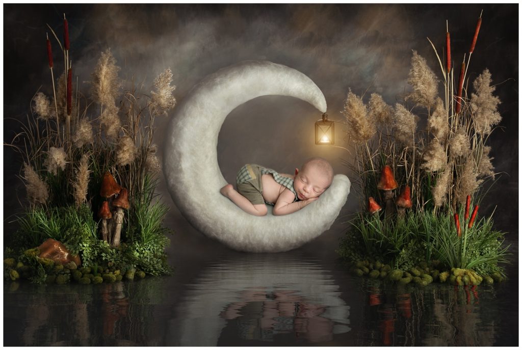newborn boy composite image on moon at the lake