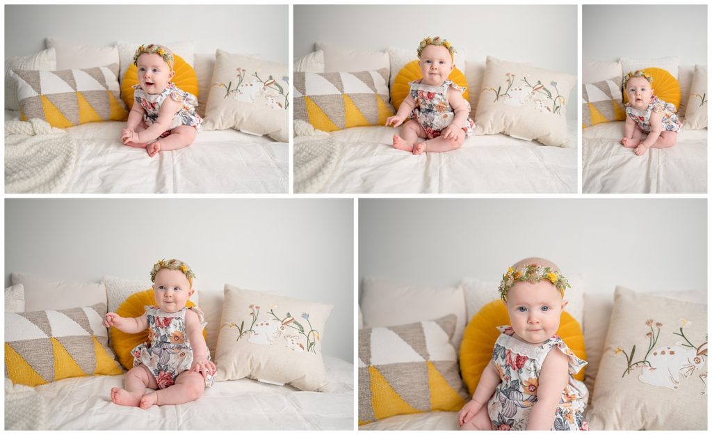 lifestyle baby girl sitting on a bed