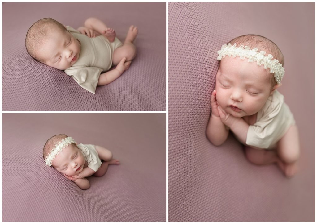 sleeping baby girl on purple background 