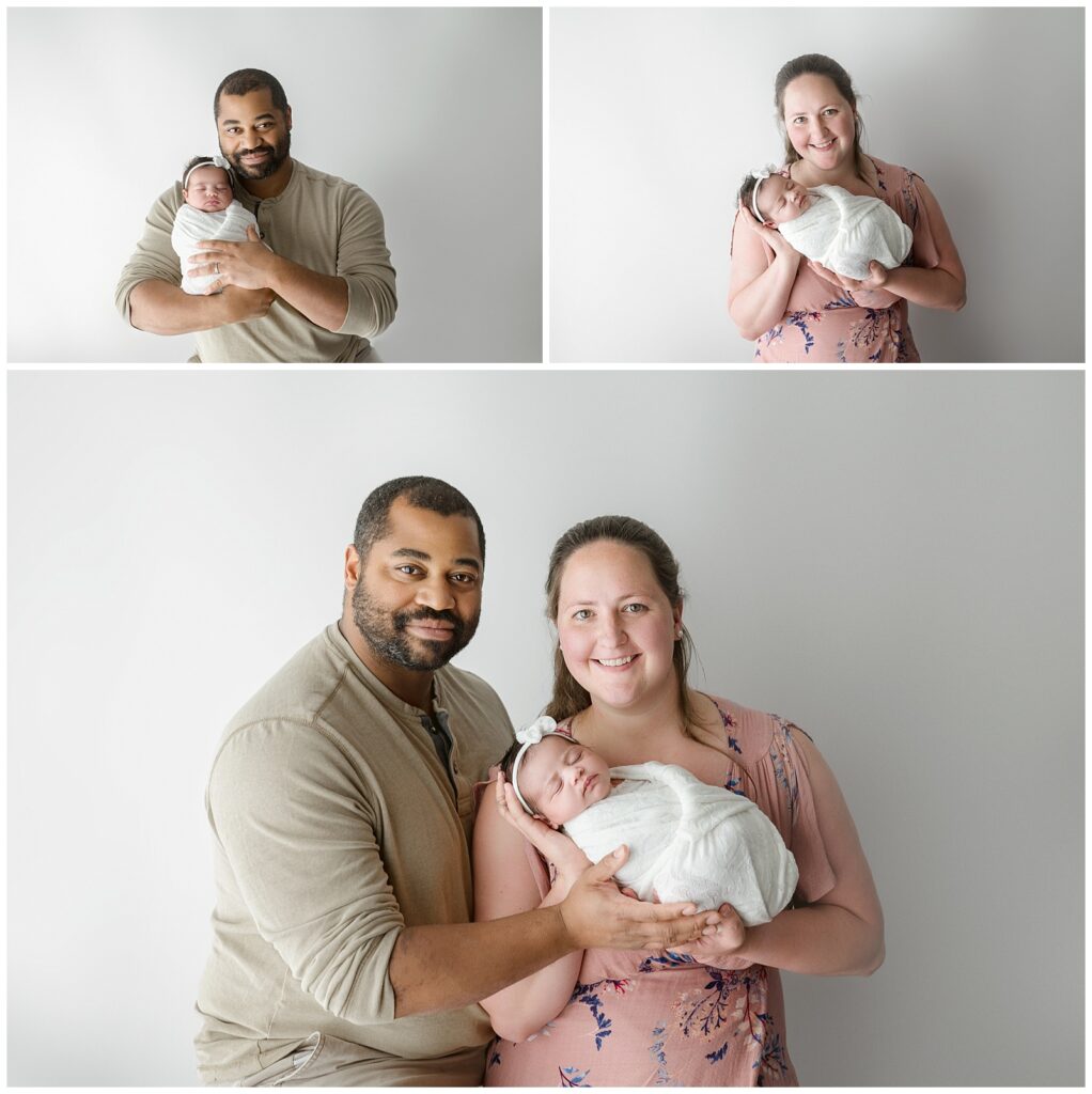 swaddled baby and parent poses with white background