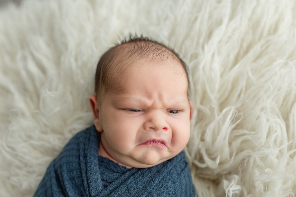 Frowning grumpy baby